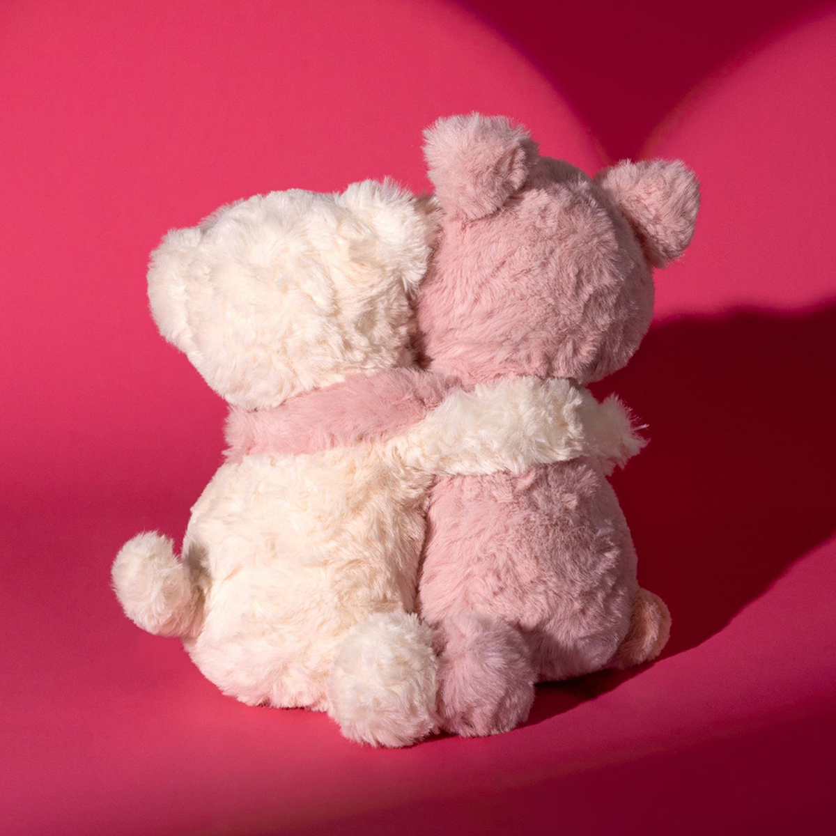 Piggy and pup plush pair hugging